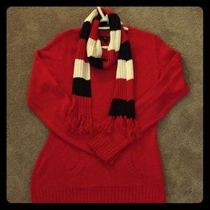 Red sweater with red, white, black scarf